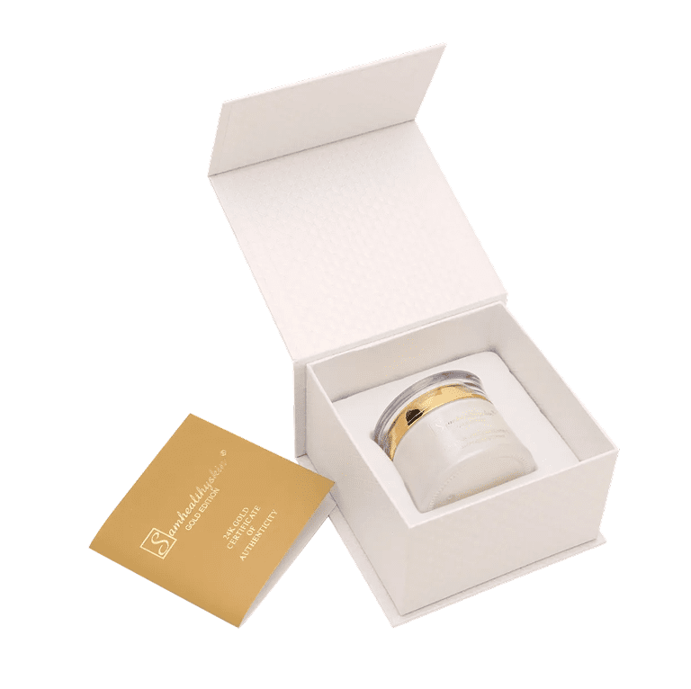 Open gift box displaying SamHealthySkin Pure 24K Gold Vitamin C Brightener jar 50 mL and gold product card